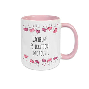 Tasse mit Spruch "Lächeln! Es irritiert die Leute" - Druckerino