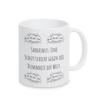 Tassen mit Sprüchen "Sarkasmus: Eine Schutzschicht gegen die Dummheit der Welt" blah blah blah - Druckerino